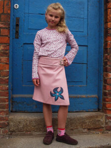 Kinderlederrock rosa mit Blume